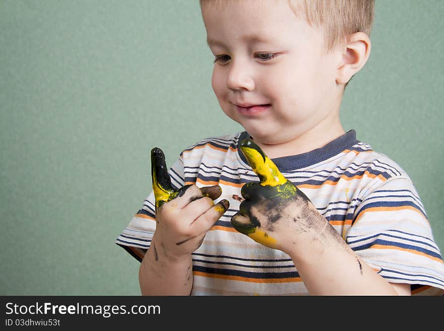 Dirty little boy sketching finger. Dirty little boy sketching finger.