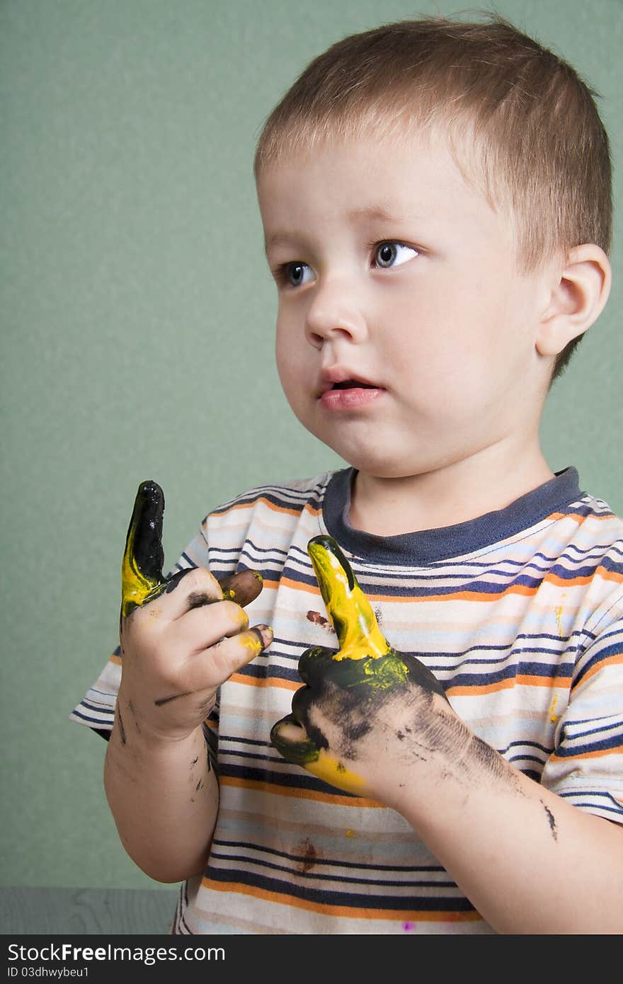 Dirty little boy sketching finger. Dirty little boy sketching finger.