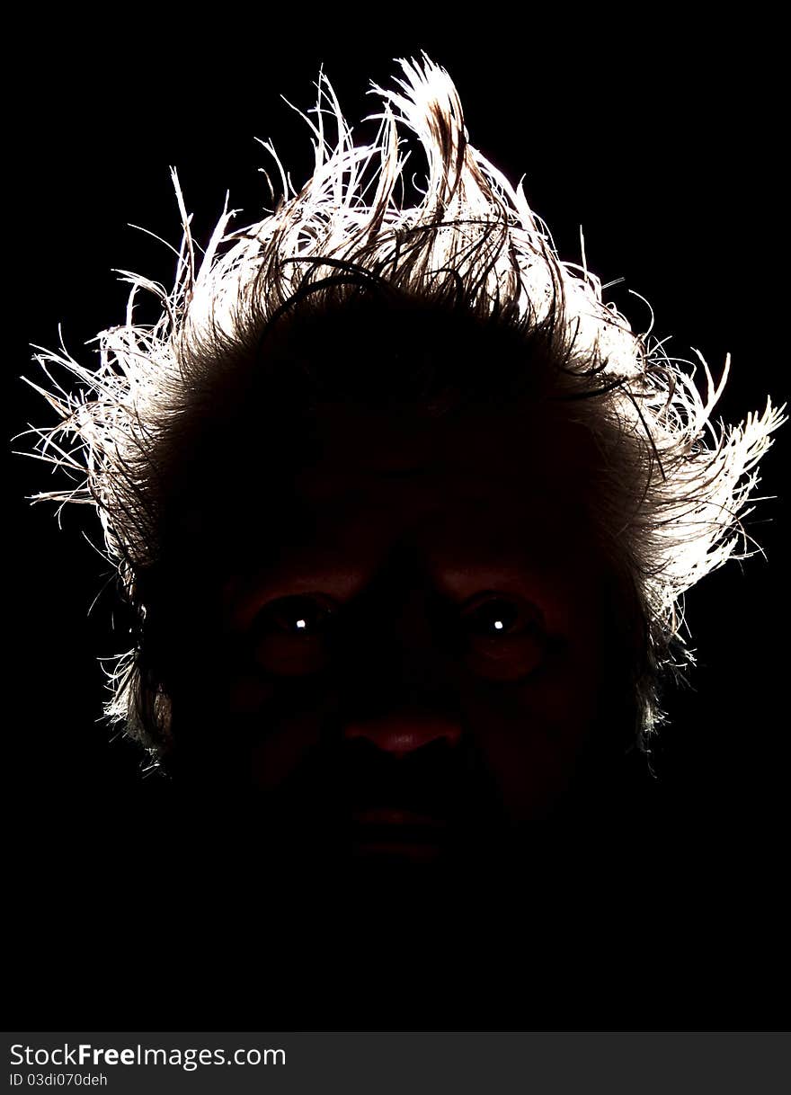 Head with hair and shiny eyes on dark background. Head with hair and shiny eyes on dark background