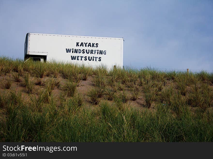 Truck advertising renting for kayaks, windsurfing and wetsuits in a beach in the south west of the UK. Truck advertising renting for kayaks, windsurfing and wetsuits in a beach in the south west of the UK