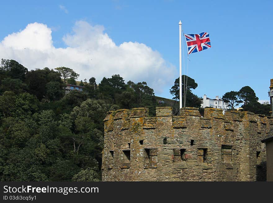 British flag in the tower of an old castle in Devon, in the south of England