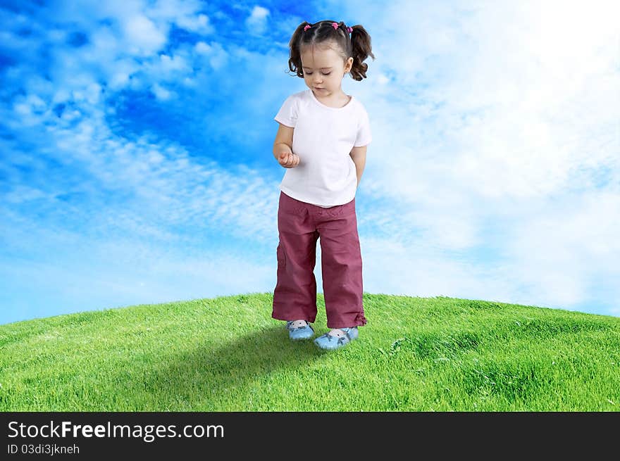 The happy child playing in the field. The happy child playing in the field