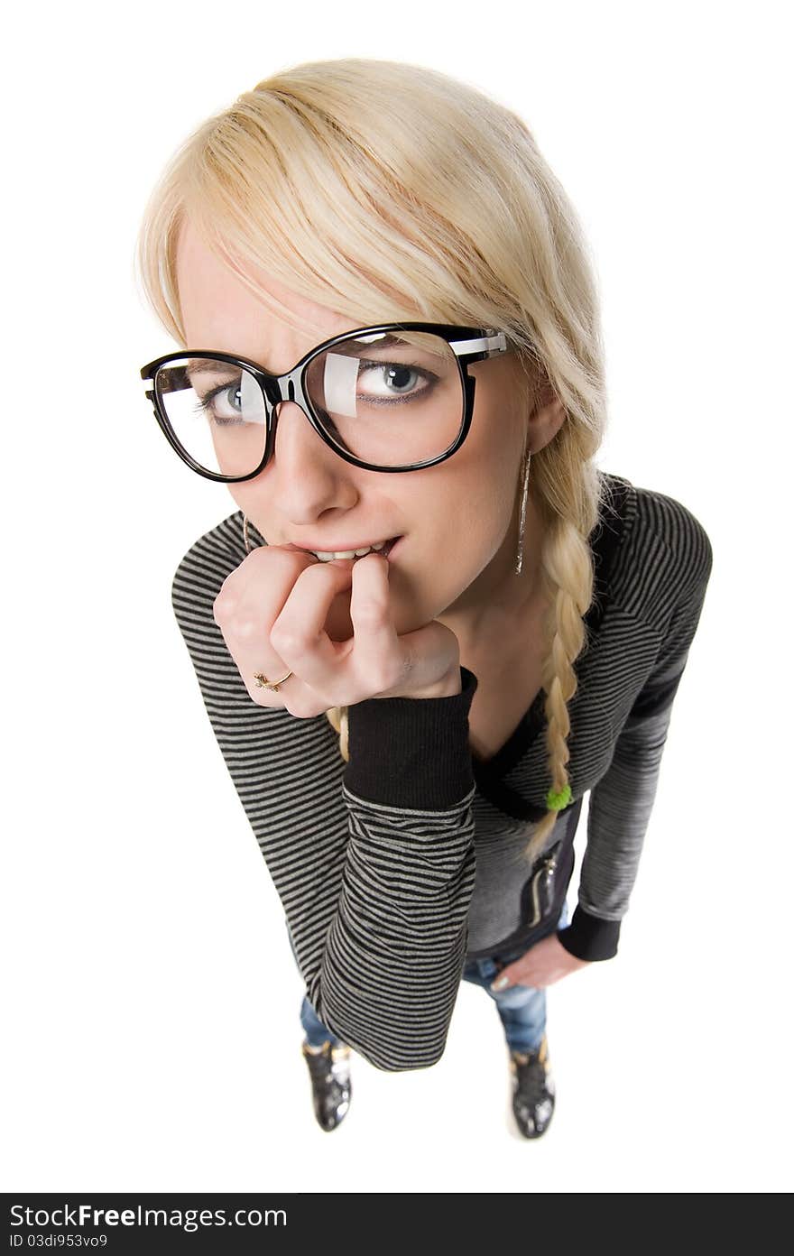 Smart young blond woman with funny glasses and plait looks like nerdy girl. Pose and looking at camera, humor style on white background. Smart young blond woman with funny glasses and plait looks like nerdy girl. Pose and looking at camera, humor style on white background.