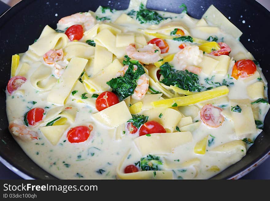 Pasta with shrimp, tomatoes and spinach. Pasta with shrimp, tomatoes and spinach.