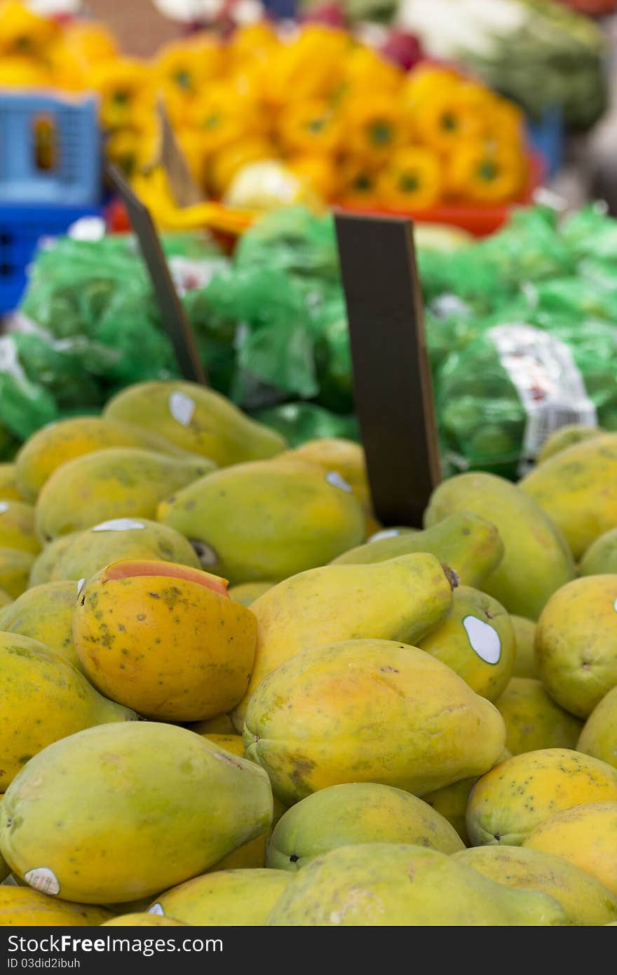 View of some fruits and vegetables on a street market's table.