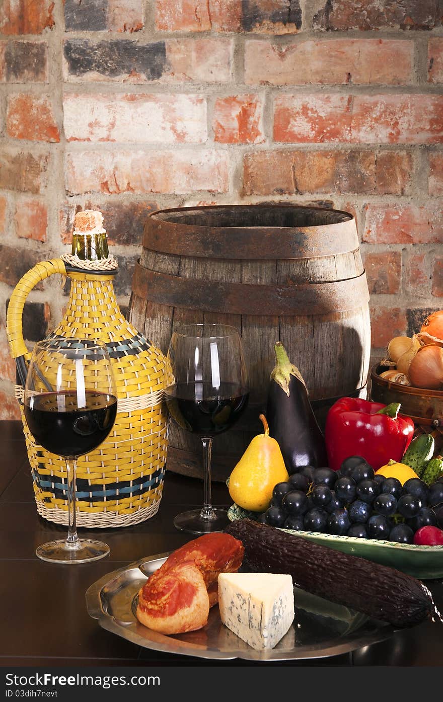 Still life with wine and some fruits,vegetables