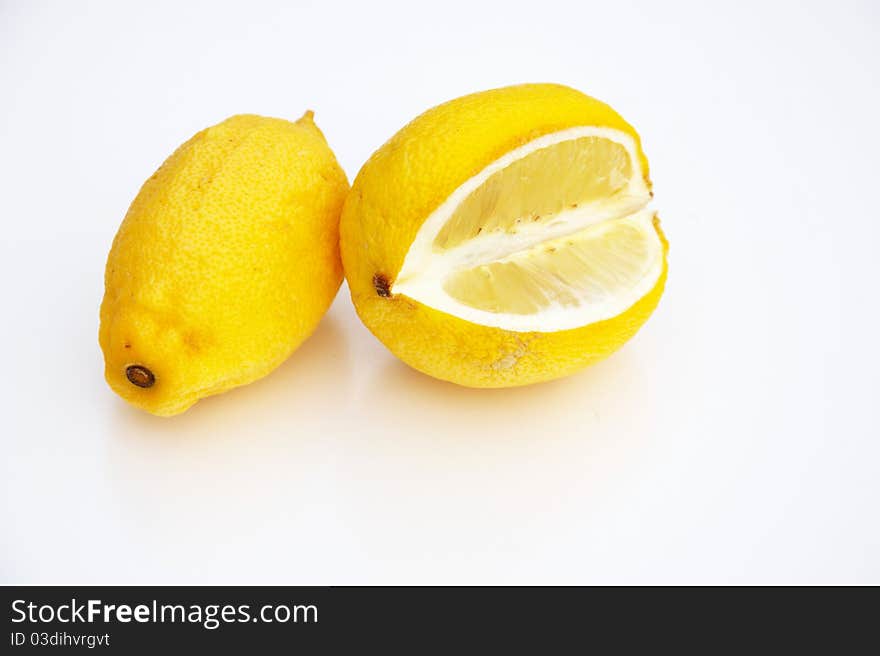 Two lemon isolated on white.