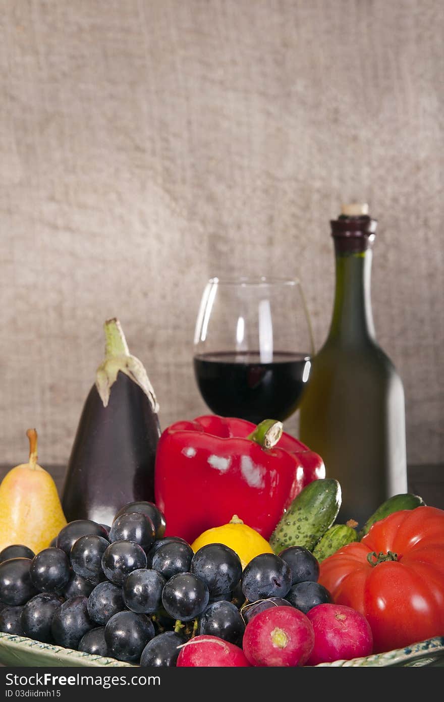 Still life with wine and some fruits,vegetables