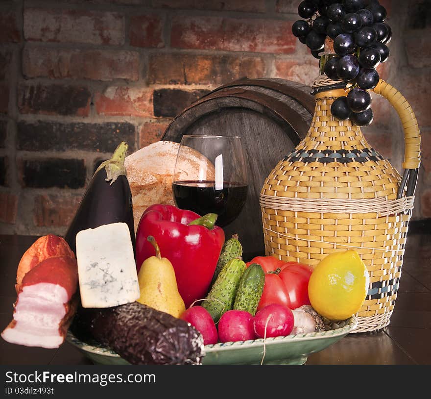 Vegetables, cheese and ham. Against the backdrop of a brick wall. Vegetables, cheese and ham. Against the backdrop of a brick wall.