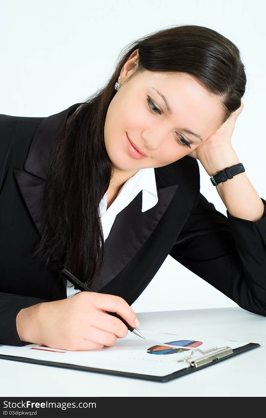 Nice girl in a business suit working in the office. Nice girl in a business suit working in the office