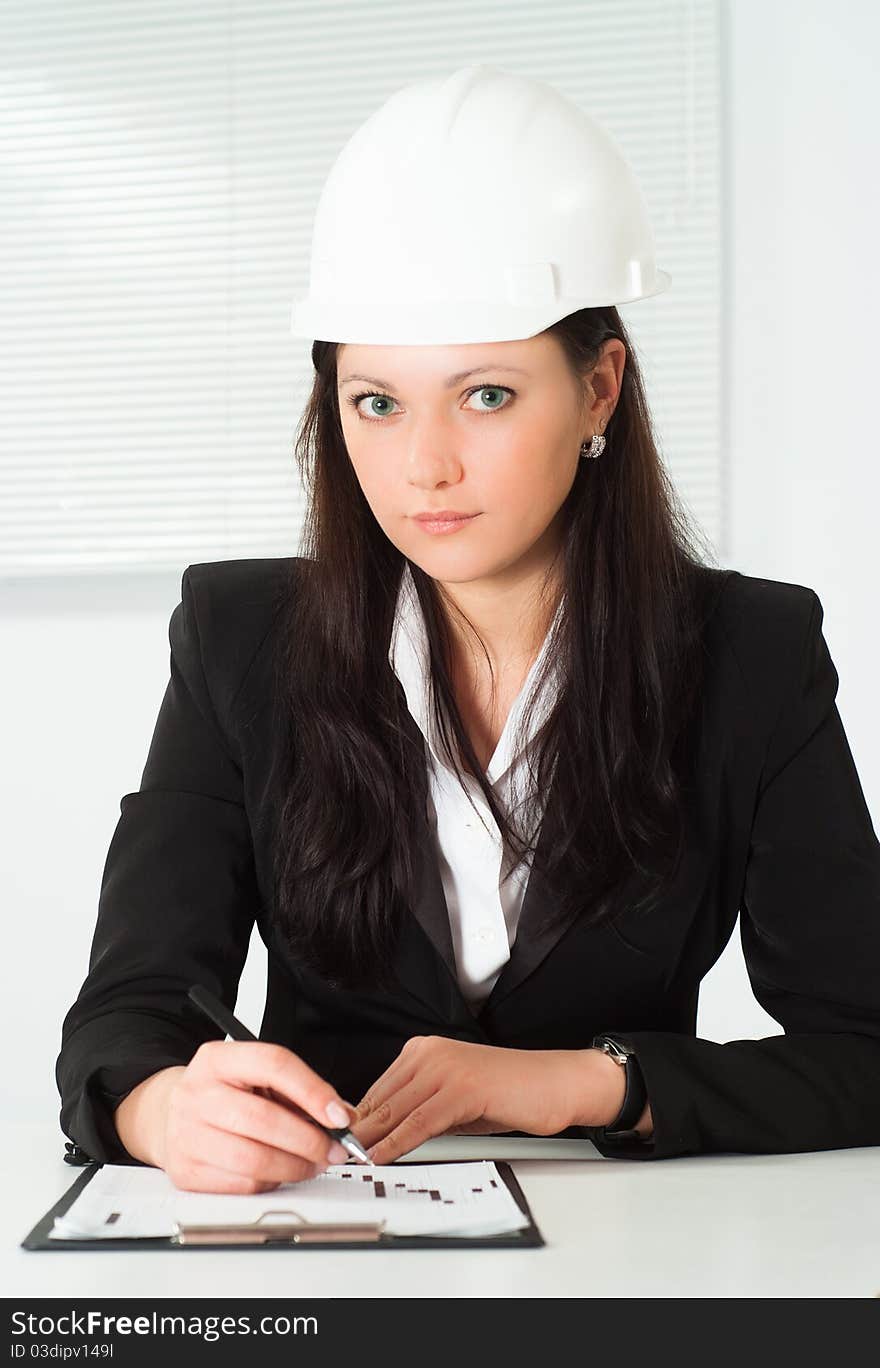 Nice woman in a business suit working in the office