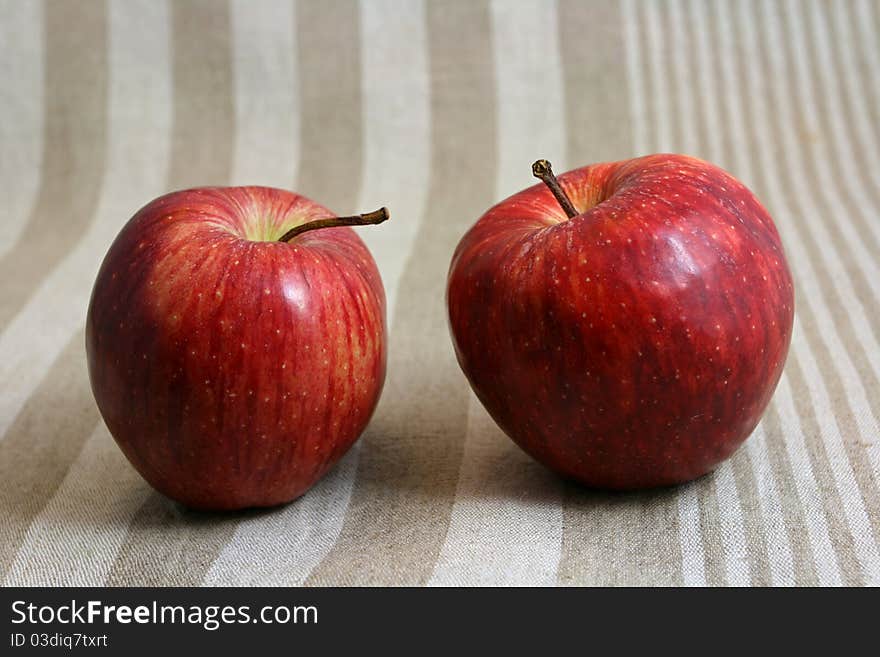 Two apples on linen napkin