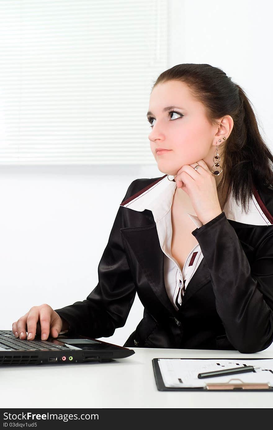 Woman in a business suit working in the office. Woman in a business suit working in the office