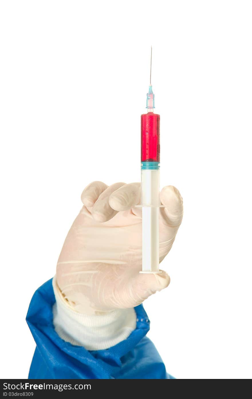 Hand of a  surgeon holding a syringe in white background