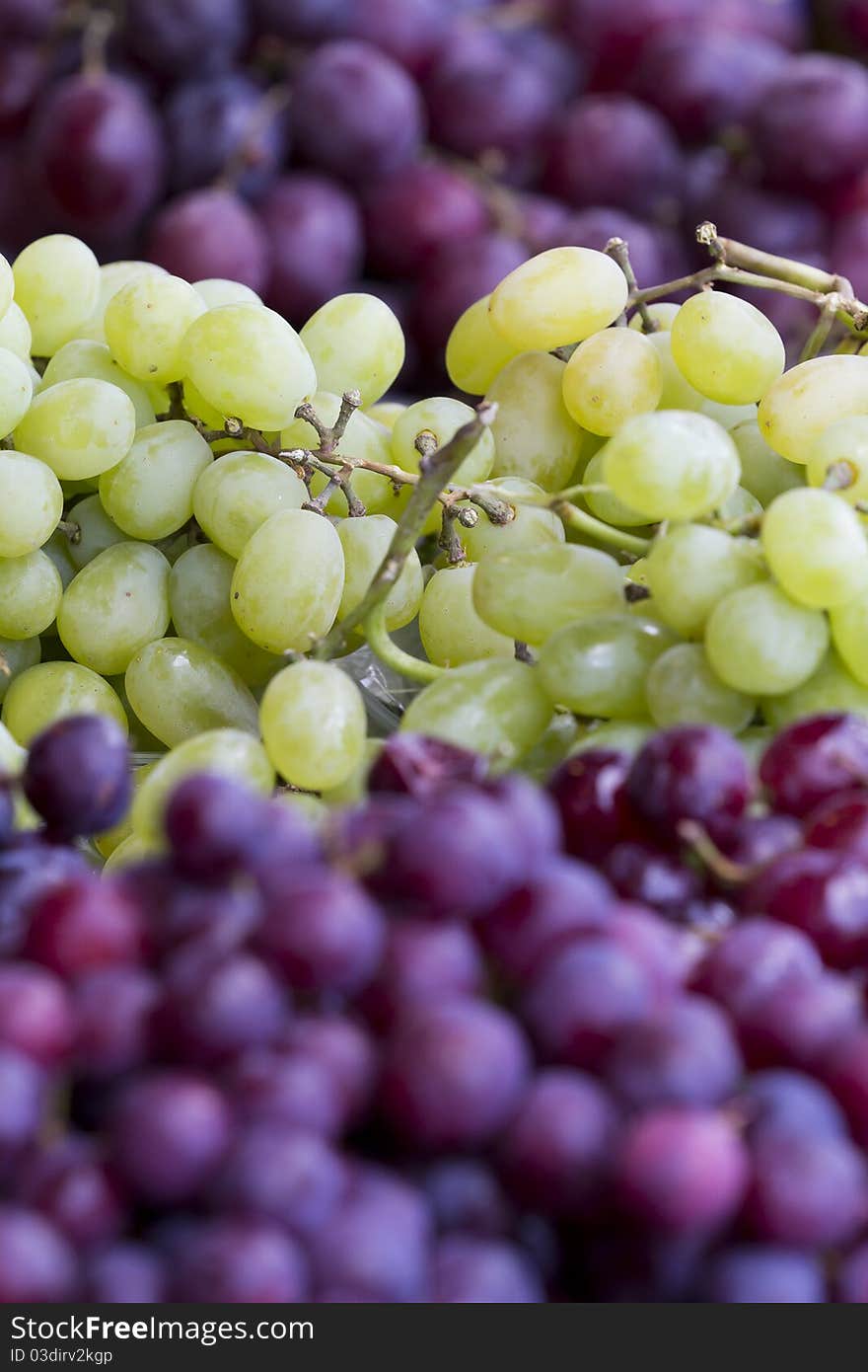 Pile of Green and Purple Grapes.