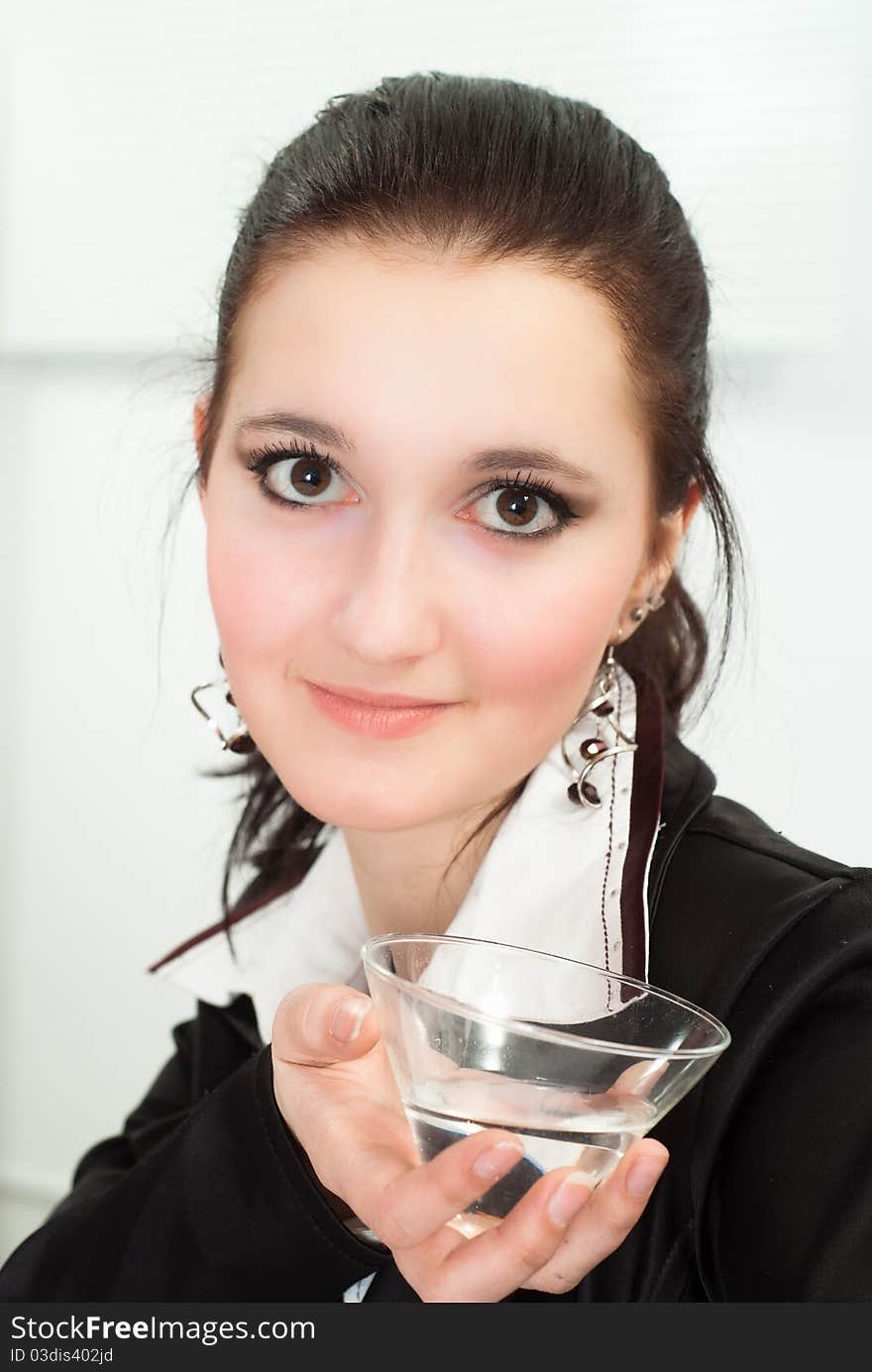 Nice woman in a black business suit on a white