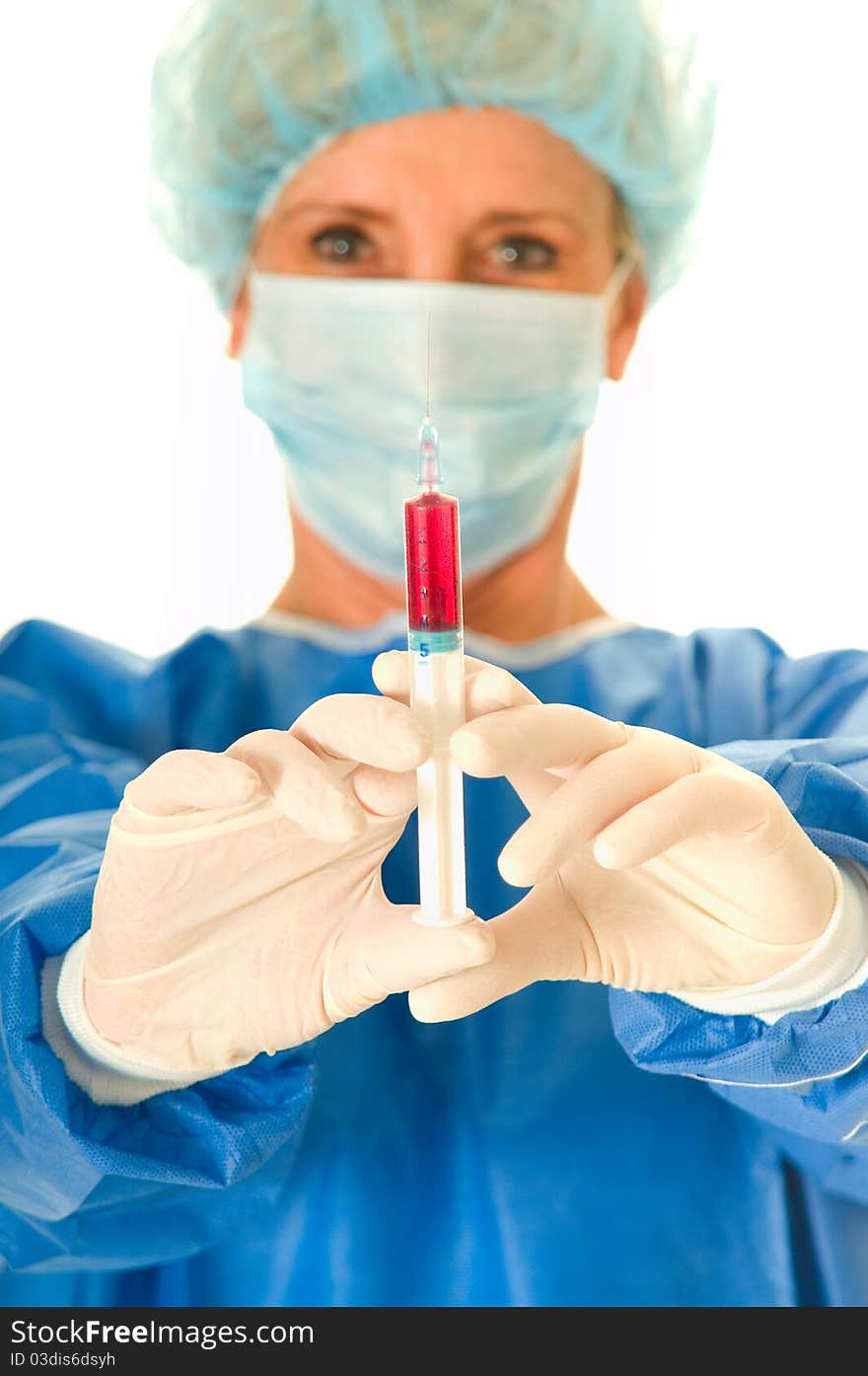 Woman surgeon holding a syringe in white background