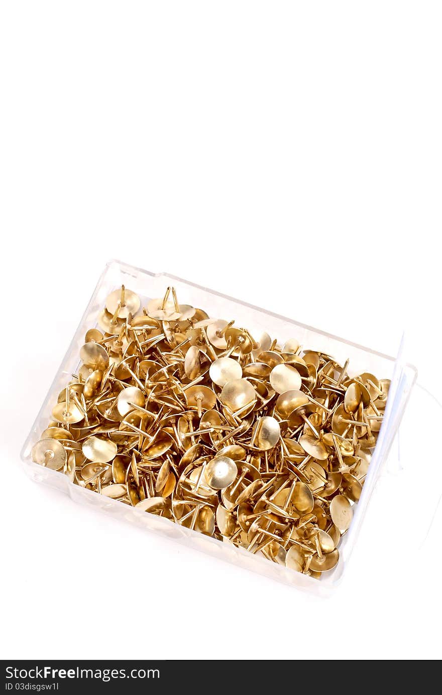 Golden Thumb Tacks In Container