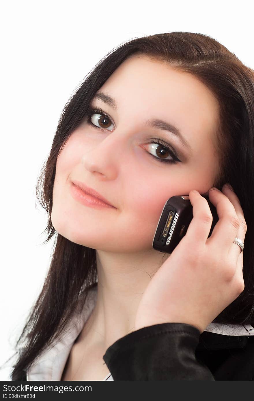 Girl in a business suit talking on the phone. Girl in a business suit talking on the phone