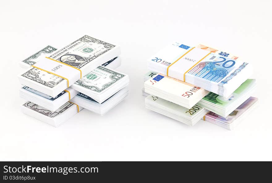 Stacks of dollars and euros. Stacks of dollars and euros