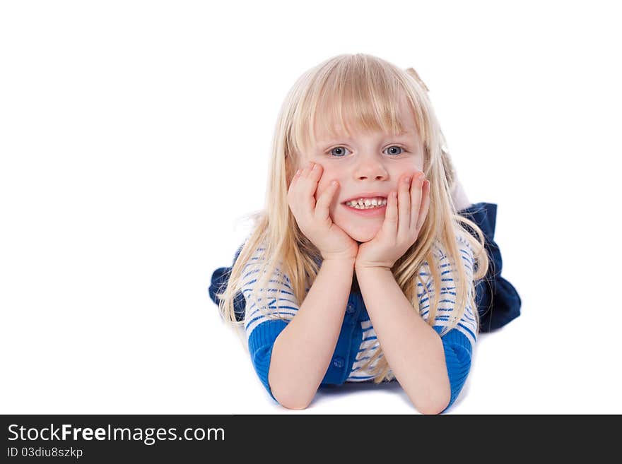 Happy smiling little girl lie looking at camera