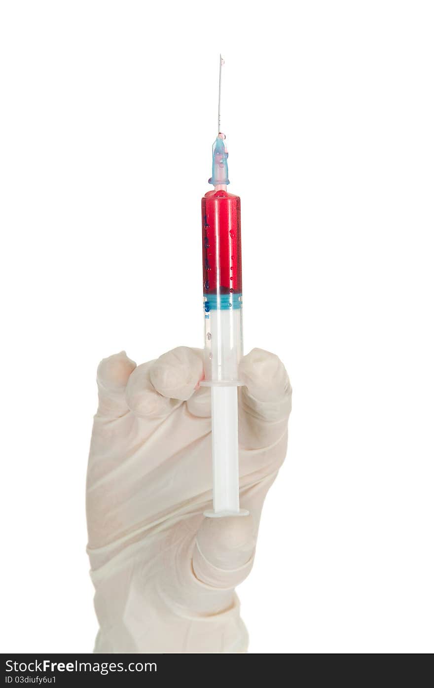 Hand Holding A Syringe