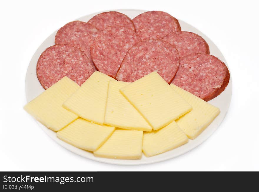 Sliced sausage and cheese on white