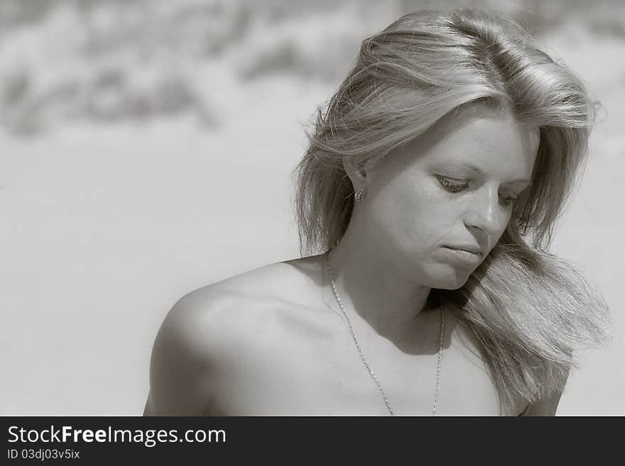 Sadly woman at a beach