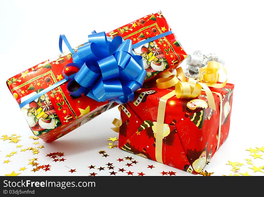 Colored Christmas' gift boxes with ribbons and stars. Colored Christmas' gift boxes with ribbons and stars