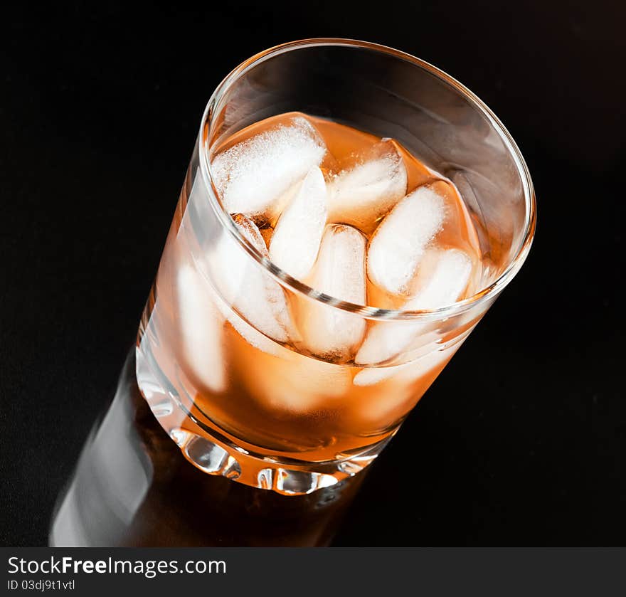 Glass of whisky with ice. Glass of whisky with ice