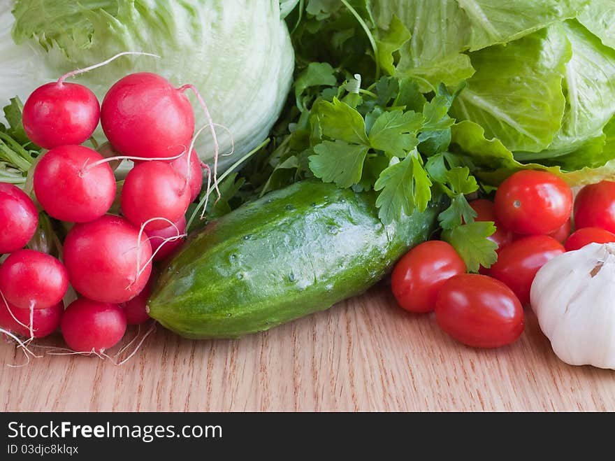 Mix of fresh vegetables on the wooden table. Mix of fresh vegetables on the wooden table.