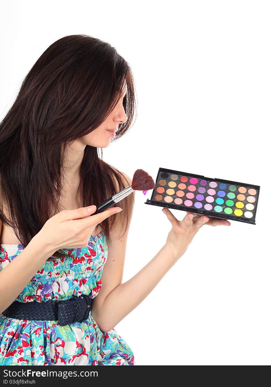 Beautiful young  woman making make-up