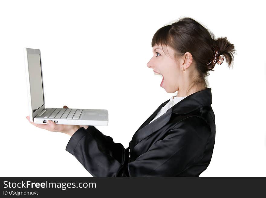 Girl yells at a laptop isolated on white. Girl yells at a laptop isolated on white