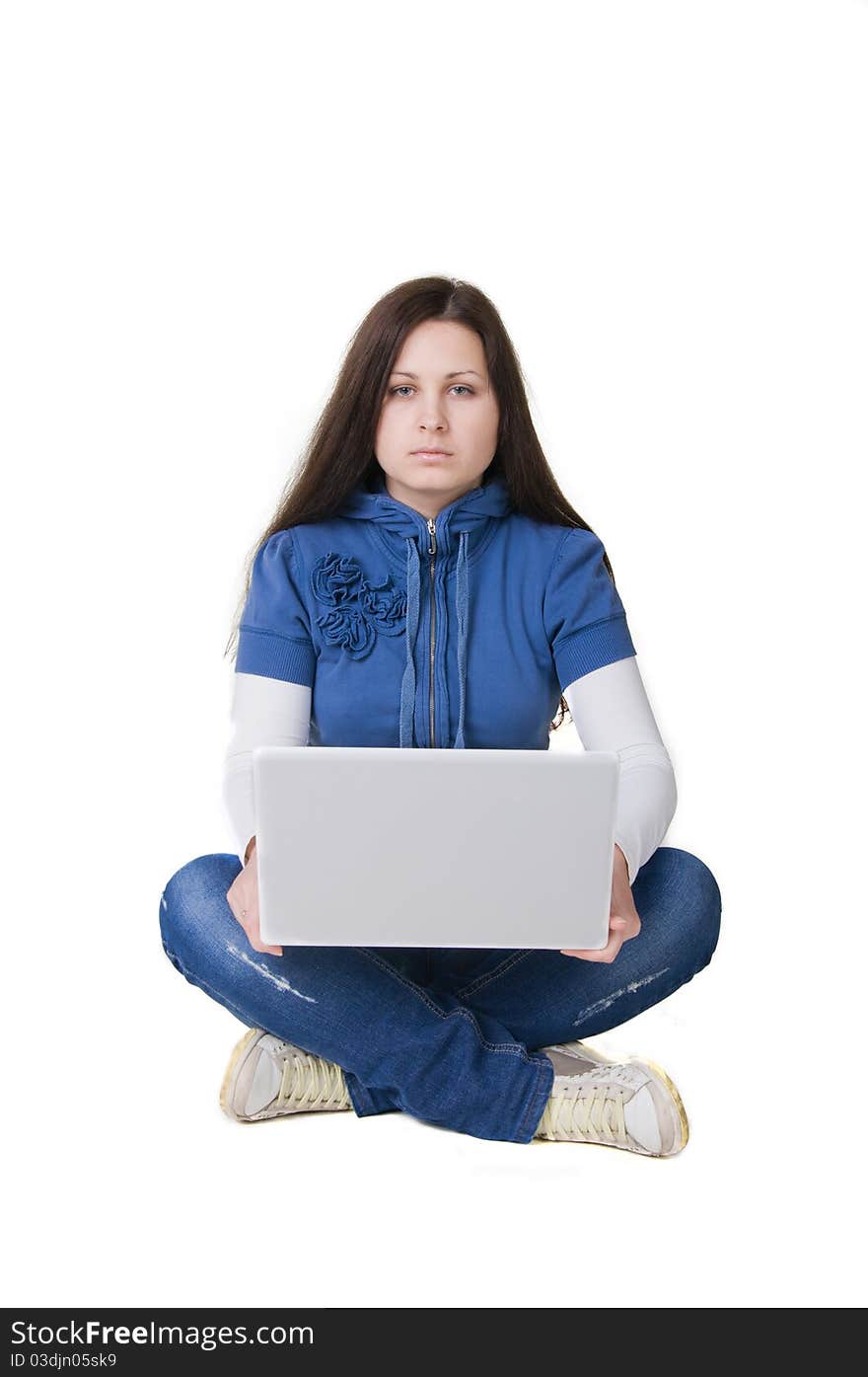 Girl sitting on the floor on her hands computer. Girl sitting on the floor on her hands computer