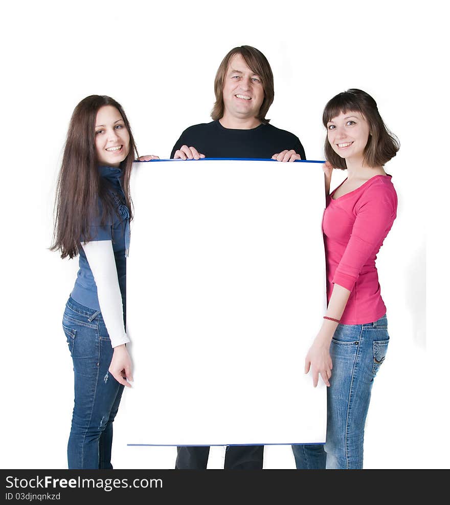 Three people, two girls and one man, holding a poster