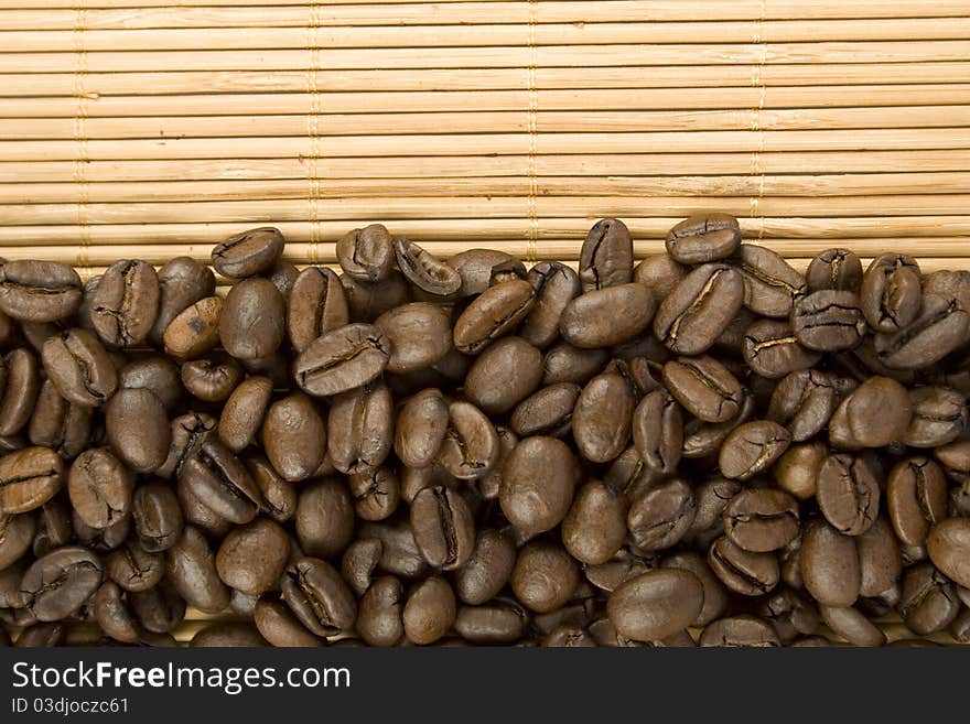 Coffee beans. Lie on a wooden surface. Top view