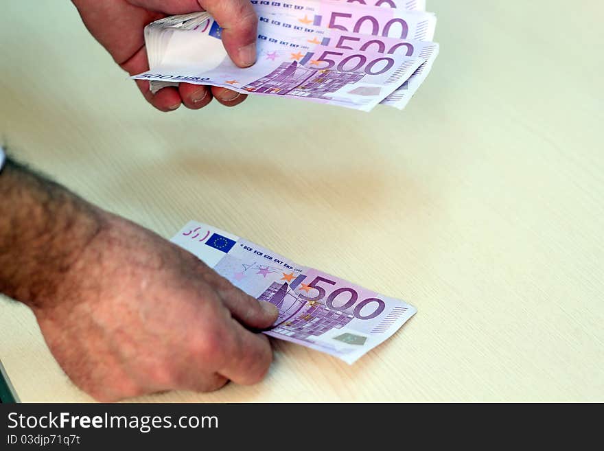 Businessman counting 500 Euro banknotes. Businessman counting 500 Euro banknotes