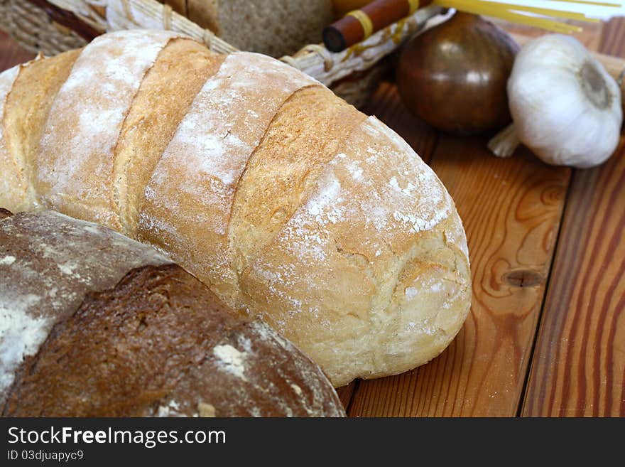 Assortment of baked bread on a wooden table