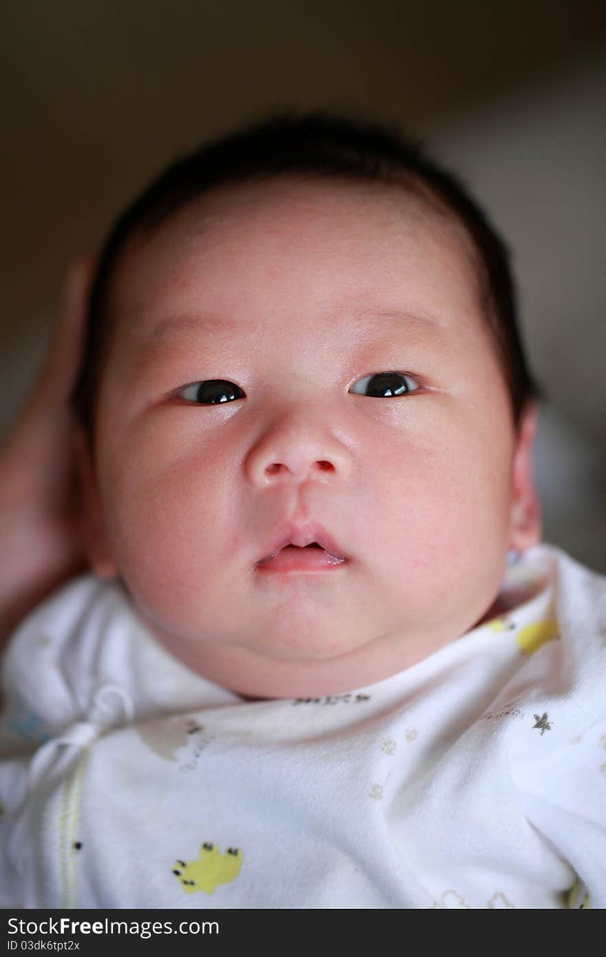 A new little born asian baby boy. A new little born asian baby boy