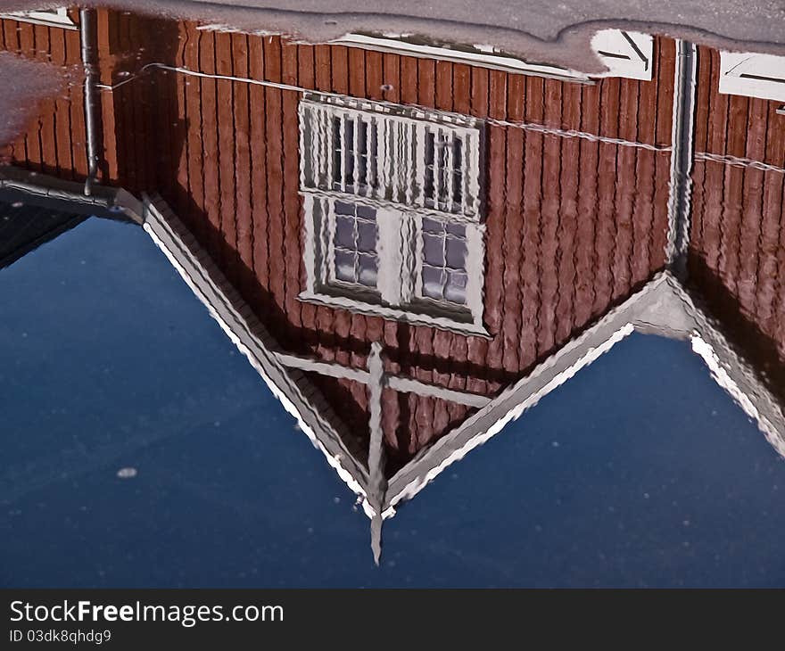 Modern classical design beach summer houses reflected perfectly in a small water pond. Modern classical design beach summer houses reflected perfectly in a small water pond