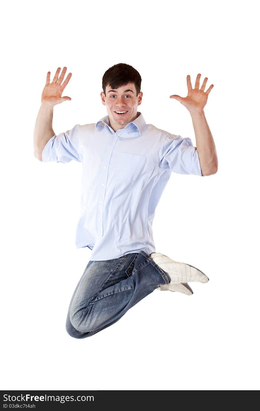 Young dynamic sportive man jumps high in the air.Isolated on white background.