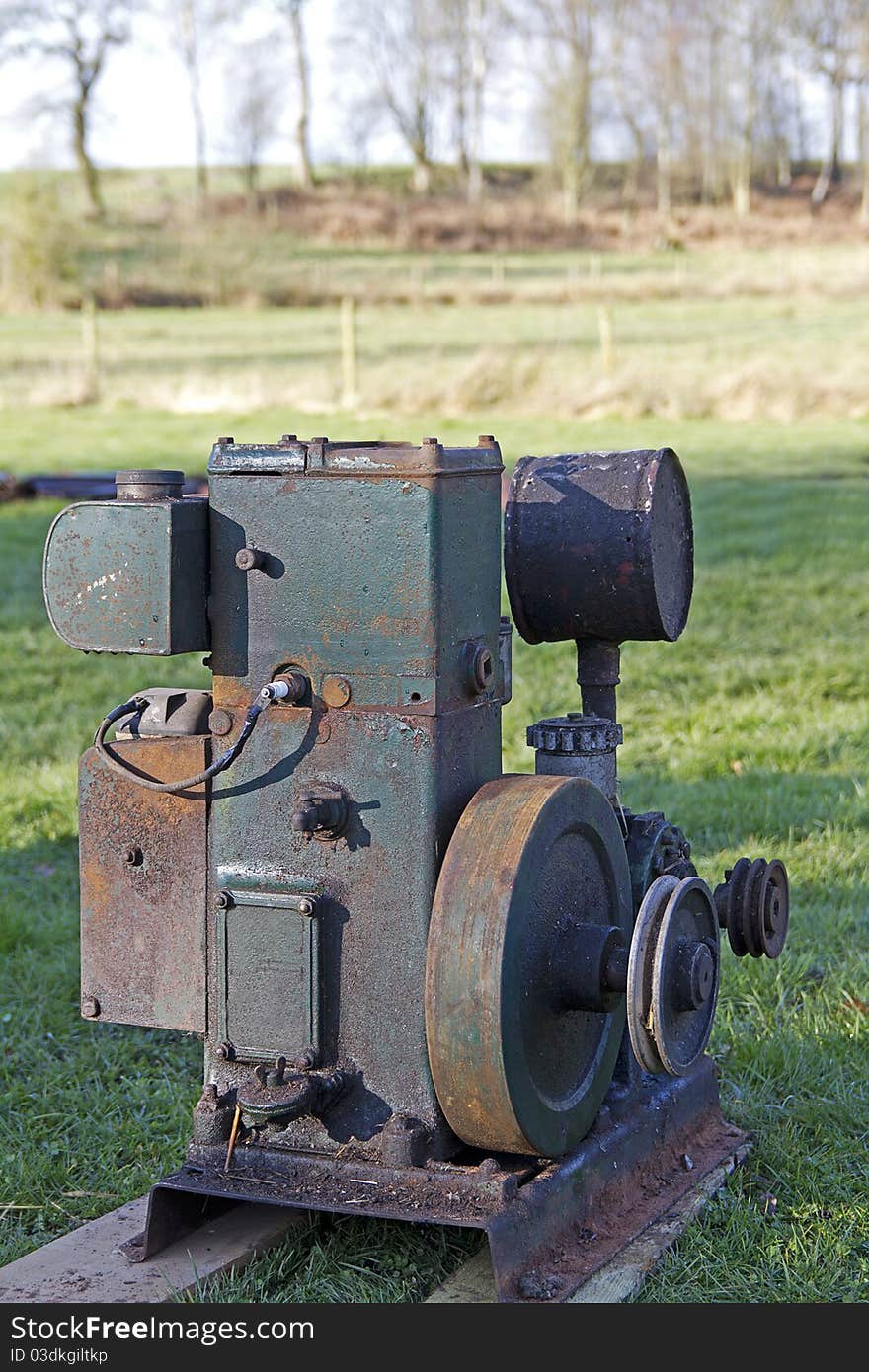 Old rusty petrol stationary engine. Old rusty petrol stationary engine