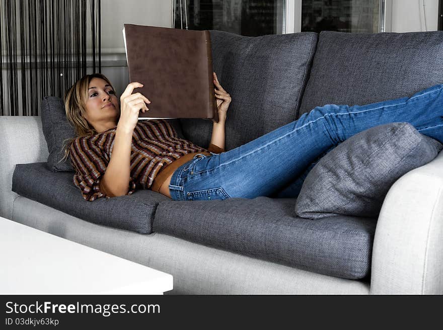 Happy Blond Woman Relaxing And Reading