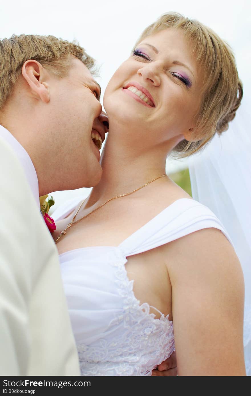 Bride and groom fooling with funny expressions