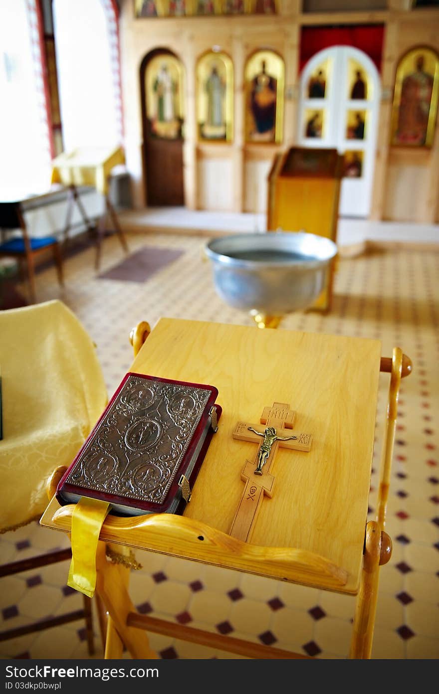 Prayer and cross with Jesus on table in Church