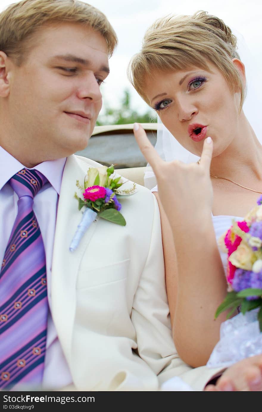 Bride and groom fooling with funny expressions