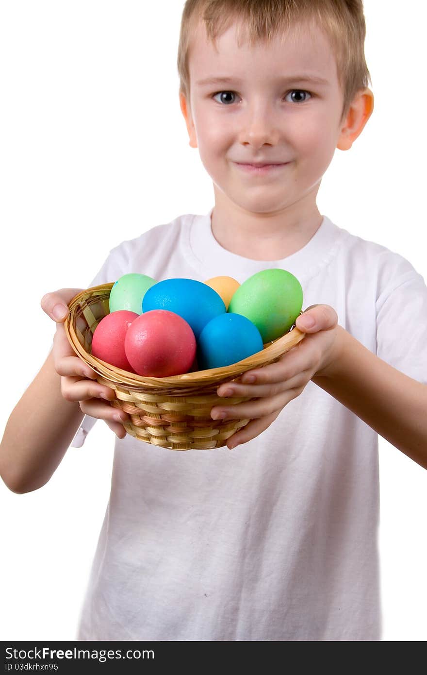 Boy with a basket with Easter eggs on a white background. Boy with a basket with Easter eggs on a white background