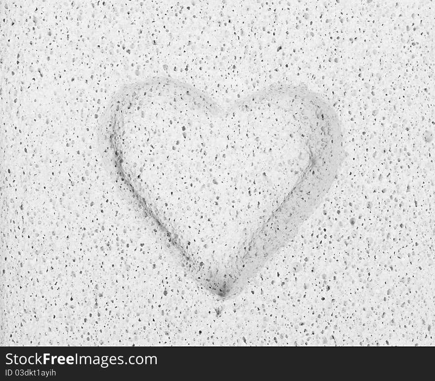 Close up of chiselled heart in stone