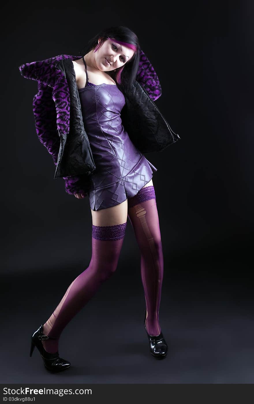 Young Girl In Purple Fur Coat And Gothic Make-up