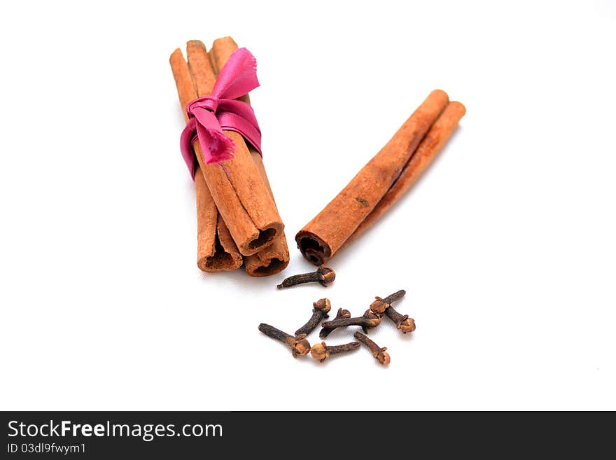 Photo of cinnamon and carnation on a white background